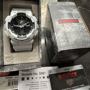 G-Shock - White watch
Both analog and digital display. 
Worn twice